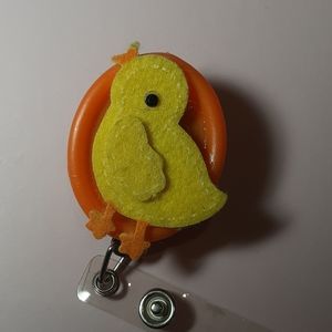 Retractable name badge holder